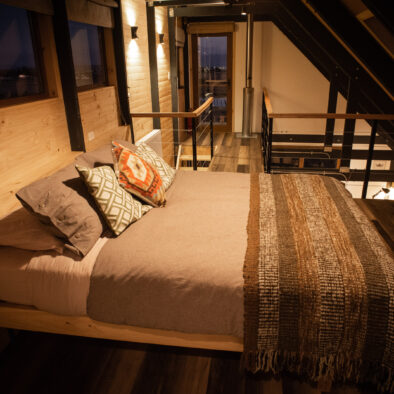 Bedroom with trundle bed and wooden details at Casa Lenga