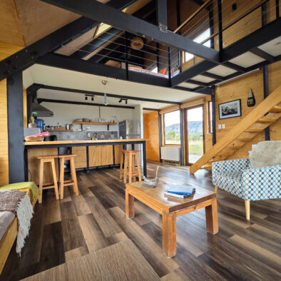 Spacious living area with picture window at Casa Lenga holiday home
